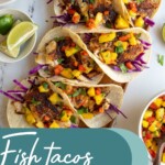 Pinterest pin with text over lay "Fish Tacos with Mango Salsa", image of blackened fish tacos with mango salsa on a tray.