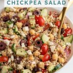 Pinterest pin with text overlay "Greek Quinoa Chickpea Salad", image of a white bowl filled with greek quinoa salad with chickpeas.