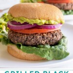 Pinterest pin with text overlay "Grilled Black Bean Burgers", image of a grilled black bean burger in a bun.