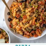 Pinterest pin with text overlay "Pizza Pasta Salad" with image of a bowl filled with colorful pizza pasta salad.