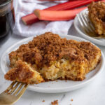 Pinterest pin with text overlay "Rhubarb Coffee Cake", image of slice of rhubarb coffee cake on a plate.