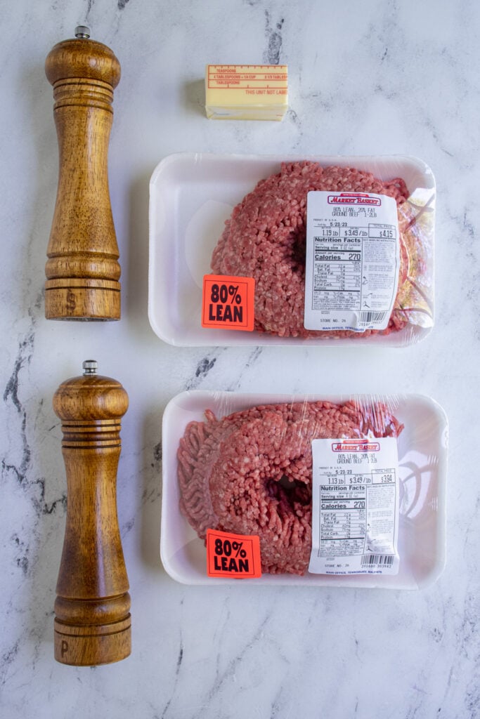 Ingredients to make blackstone smash burgers laid out on a tabletop.