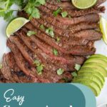 Pinterest pin with text overlay "Easy Carne Asada" with the image of sliced carne asada steak on a platter.