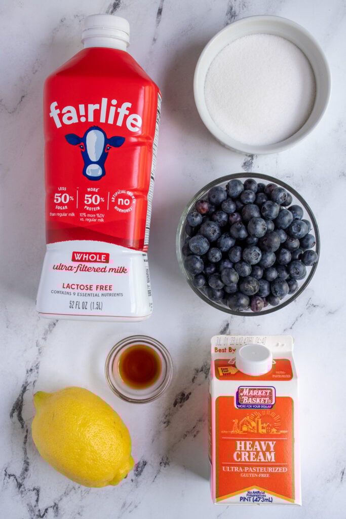 Ingredients to make homemade ice cream laid out on a table top.