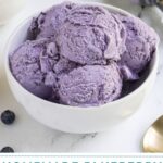 Pinterest pin with text overlay "Homemade Blueberry Ice Cream", image of a bowl with scoops of blueberry ice cream and fresh blueberries.