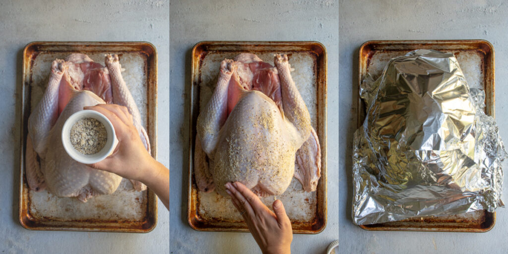 Adding rub to a turkey for deep frying.