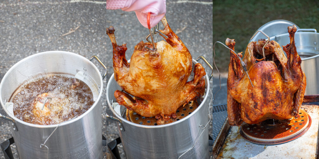 A turkey frying in a deep fryer and carefully being pulled out.