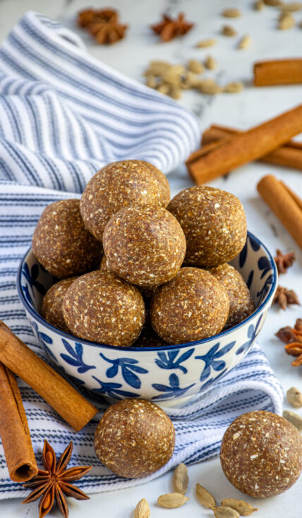 Chai spiced energy balls in a blue and white bowl.