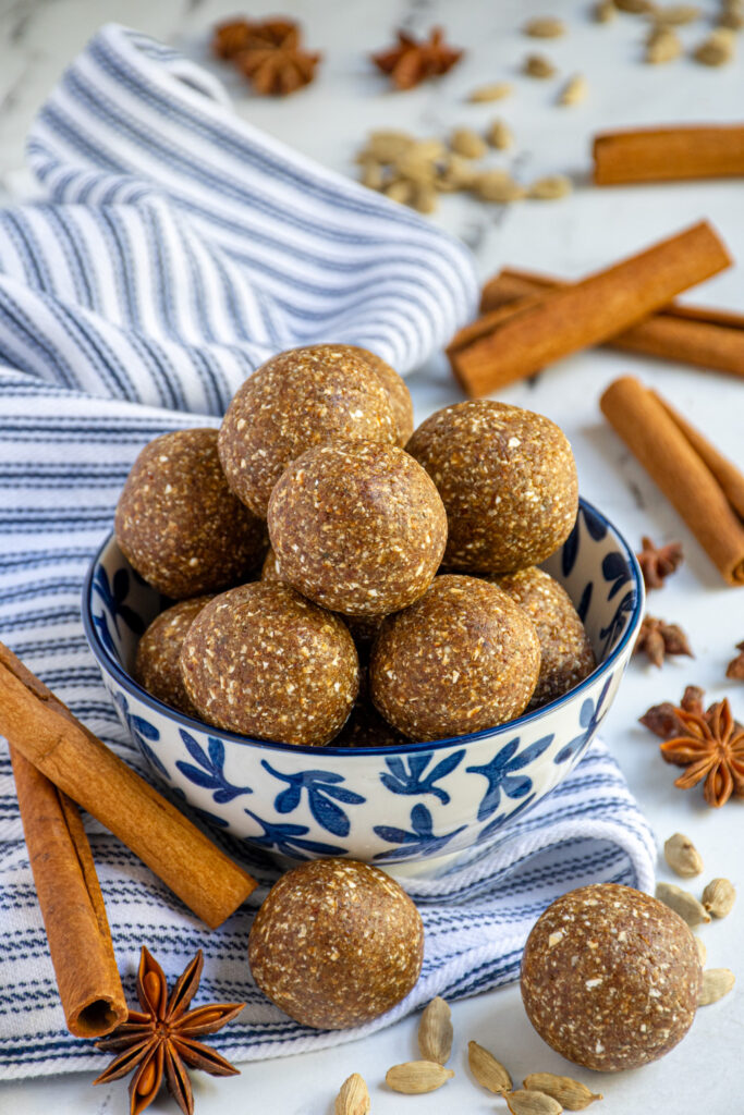 Chai spiced energy balls in a blue and white bowl.