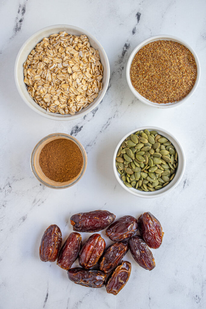 Ingredients to make chai spiced energy balls on a table top.