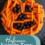 Pinterest pin with text overlay "Easy Halloween Veggie Tray", image of a pumpkin veggie tray made with baby carrots and olives.