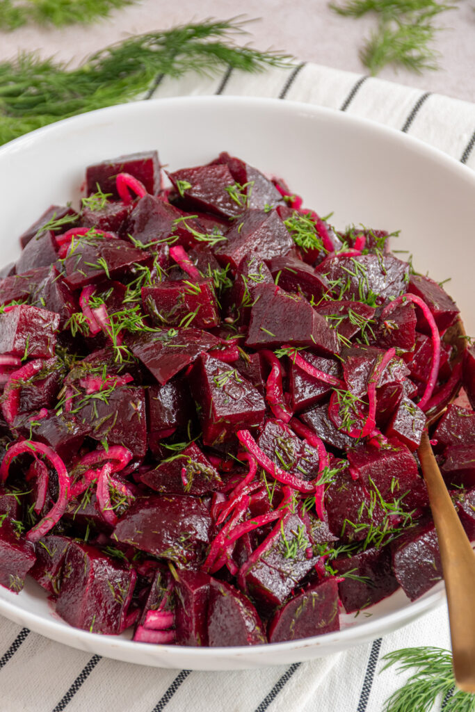 A white bowl with simple beet salad.