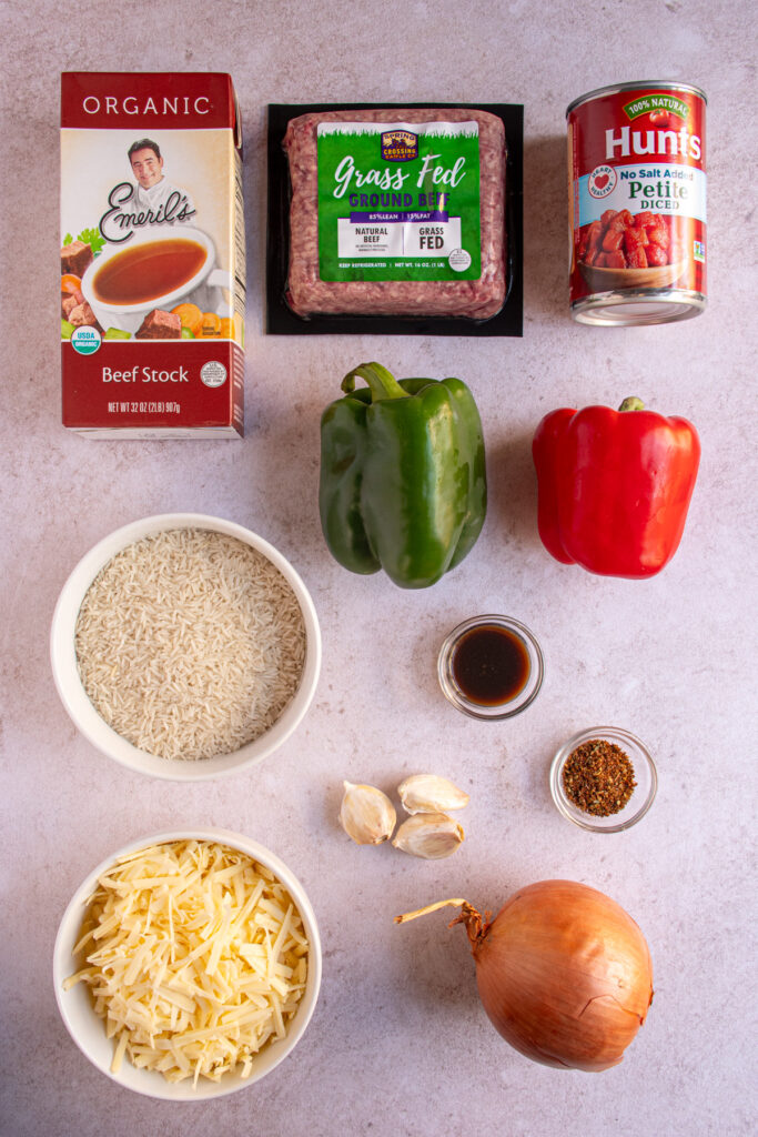 Ingredients needed to make stuffed pepper casserole laid out on a tabletop.