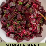 Pinterest pin with text overlay 'Simple Beet Salad', image of a serving bowl filled with beet salad topped with fresh dill.