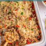 Pinterest pin with text overlay "Stuffed Pepper Casserole", image of a white baking dish with stuffed bell pepper casserole with a wooden spoon.
