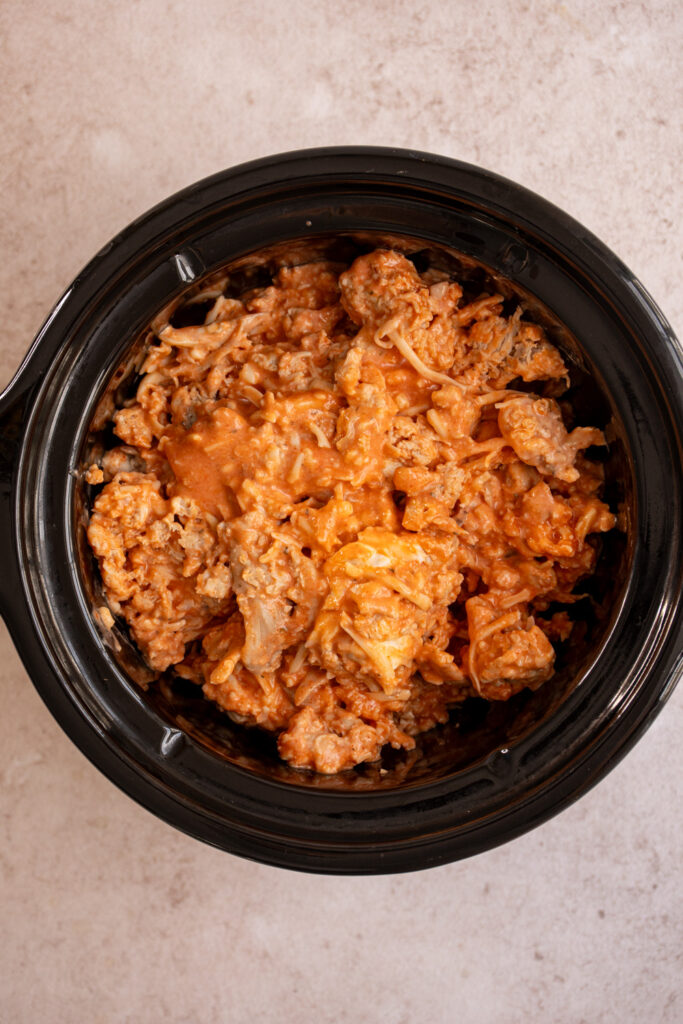 Buffalo chicken dip before being cooked in a crock pot.