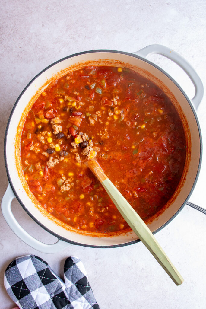 A large pot with the freshly finished ground turkey taco soup.