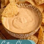 Pinterest pin with text overlay 'cottage cheese queso', image of a small yellow bowl surrounded by chips with cottage cheese queso.