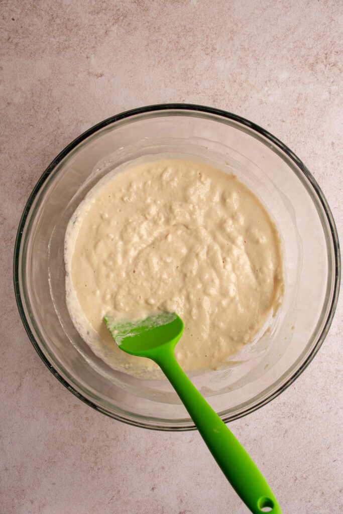 The first half of the flour mixed in with the water, yeast, and salt.