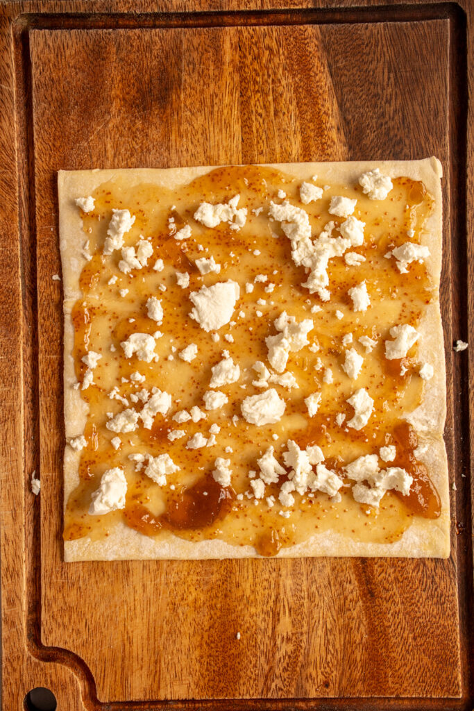 A puff pastry with fig jam and crumbled goat cheese.