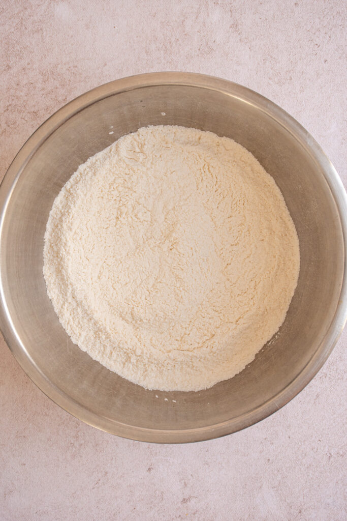 Mixing the dry ingredients together in a bowl.