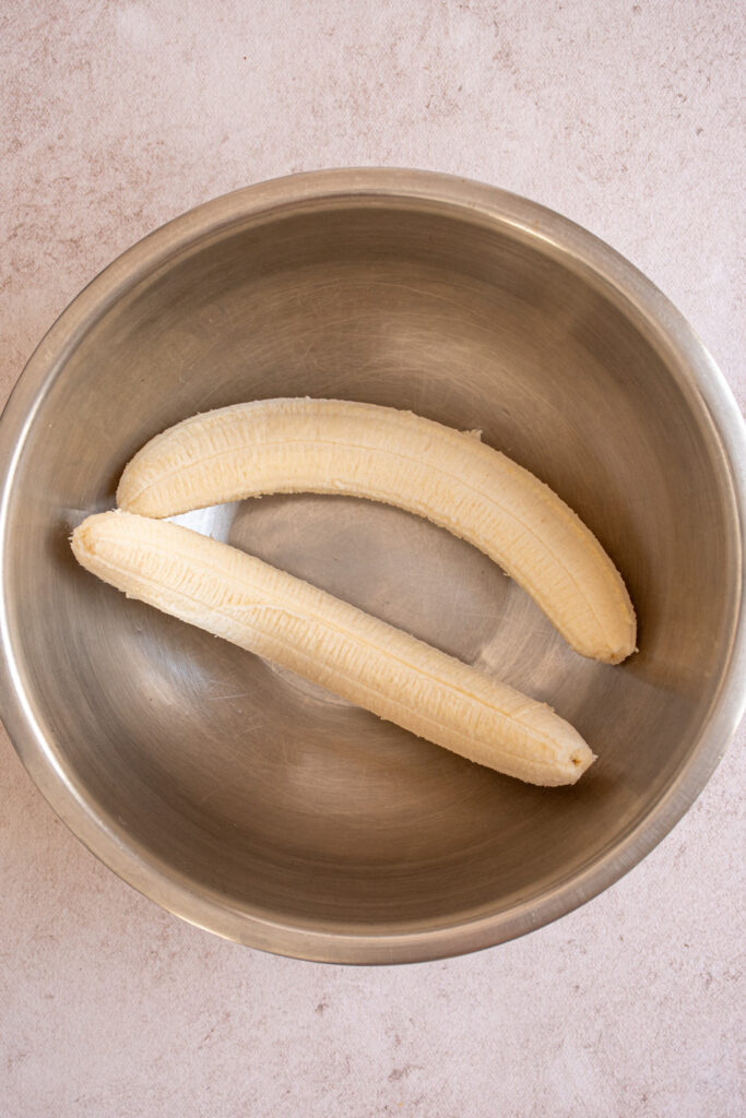 Bananas in a bowl for making Banana Chocolate Chip Pancakes.