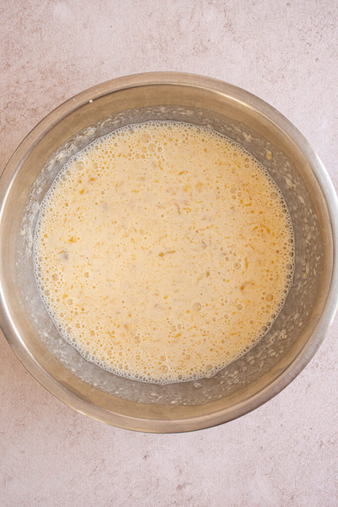 All the wet ingredients mixed together in a bowl to make Banana Chocolate Chip Pancakes.