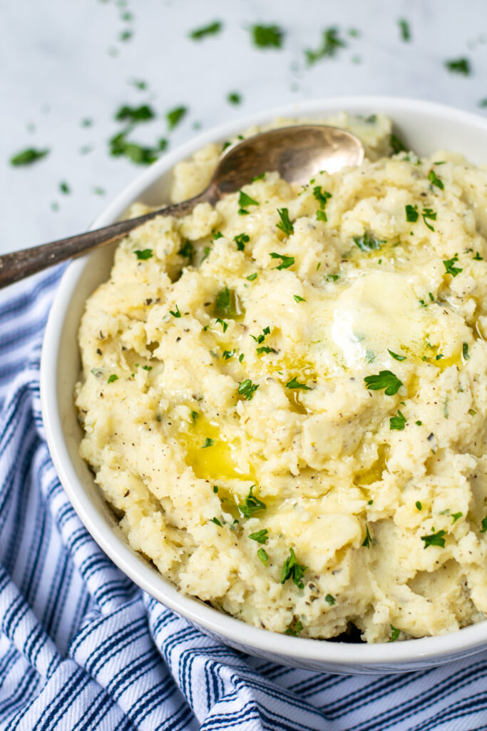 side view of a large bowl of pressure cooker mashed potatoes
