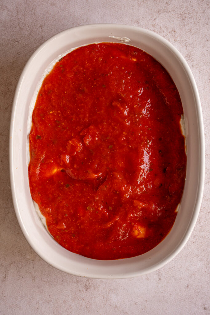 Marinara sauce overtop cottage cheese to make pizza dip.