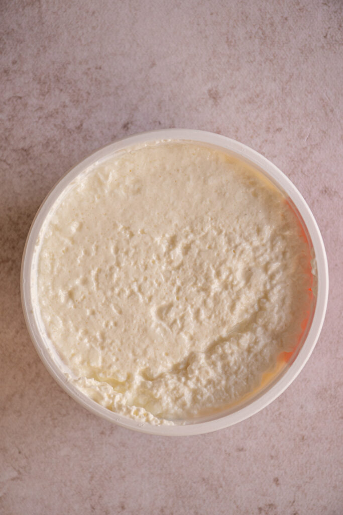 An open container of cottage cheese.