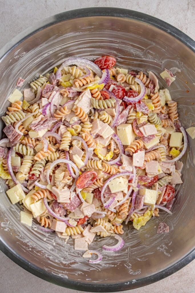 A large bowl filled with just mixed grinder pasta salad.
