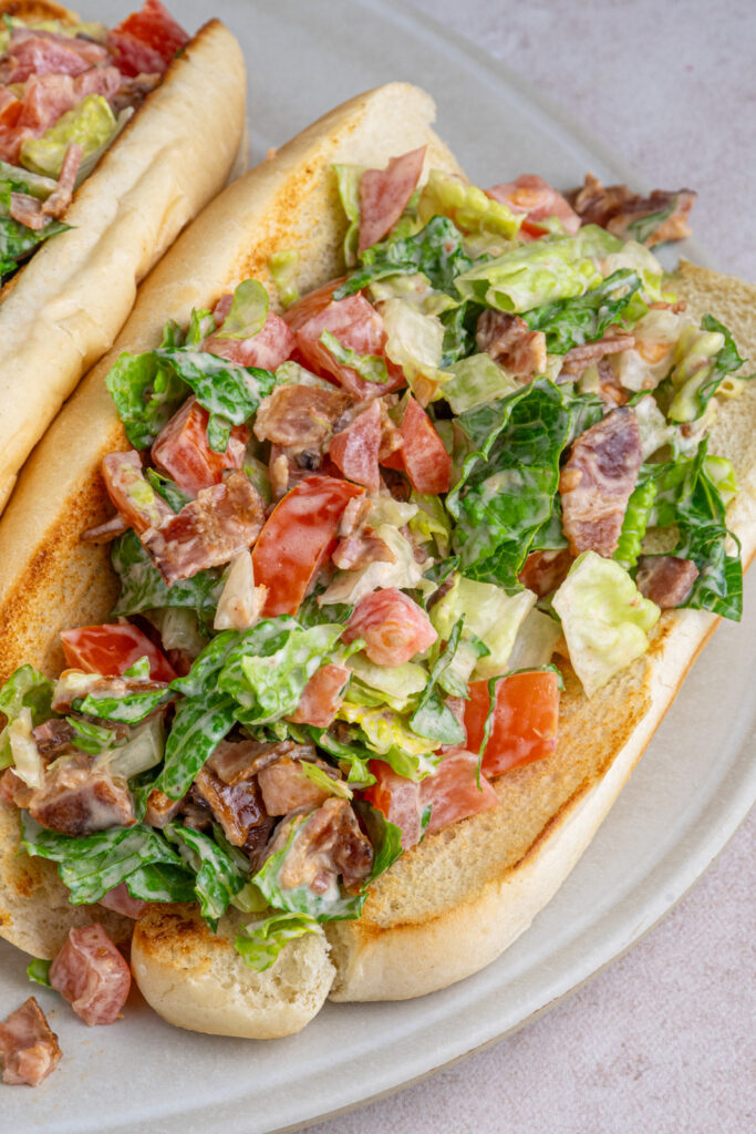 Close up of a chopped BLT sandwich on a serving platter.