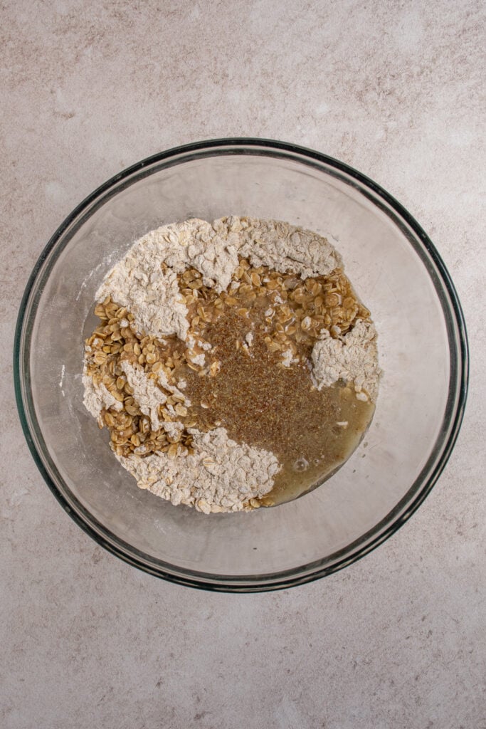 Adding the liquids to the dry ingredients.