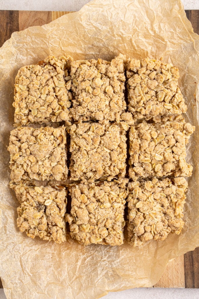 Cut fig oat bars on a piece of parchment paper.