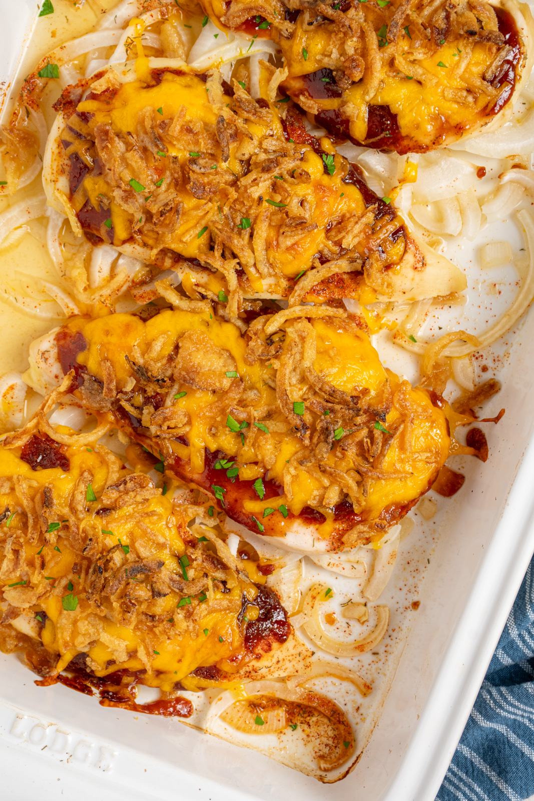 Chicken breast covered in barbecue sauce, melted cheese, and crispy fried onions.