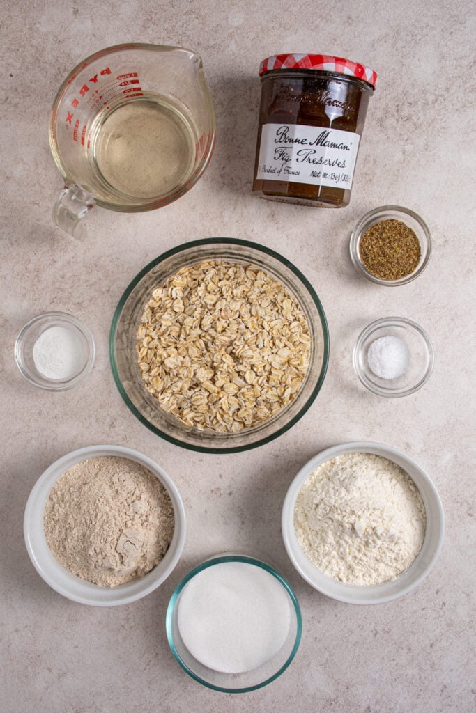 Ingredients for making homemade fig oat bars laid out on a tabletop.