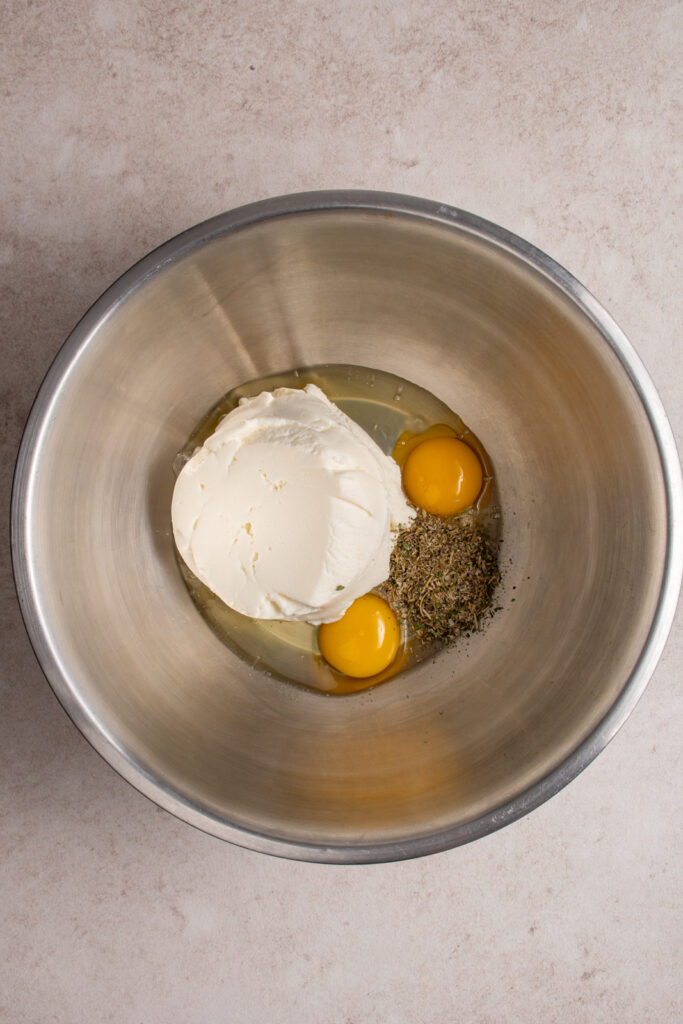 The ingredients for the ricotta mixture in a large bowl.