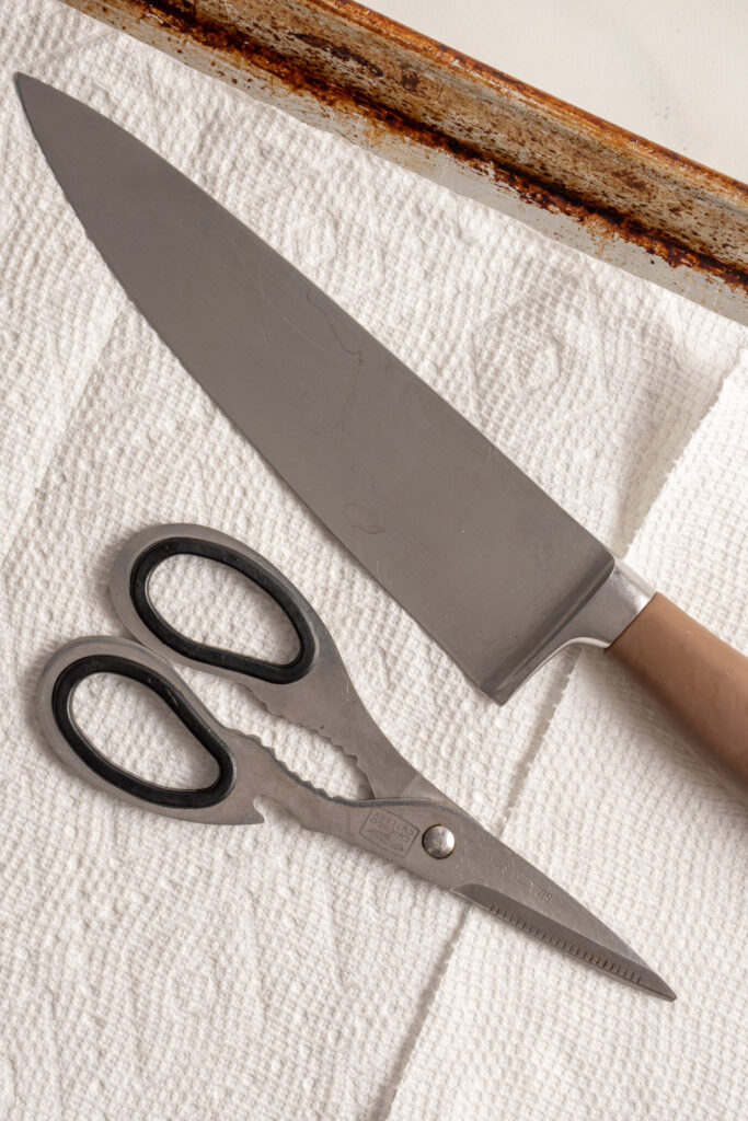 A knife and kitchen shears.
