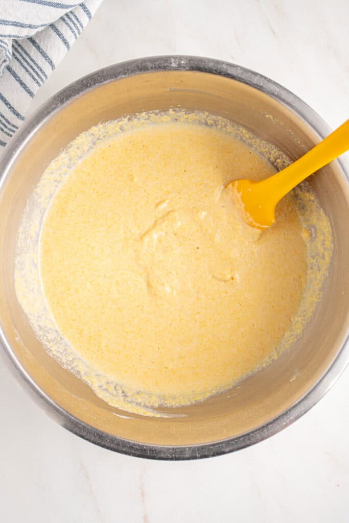Corn meal batter in a bowl for fritters.