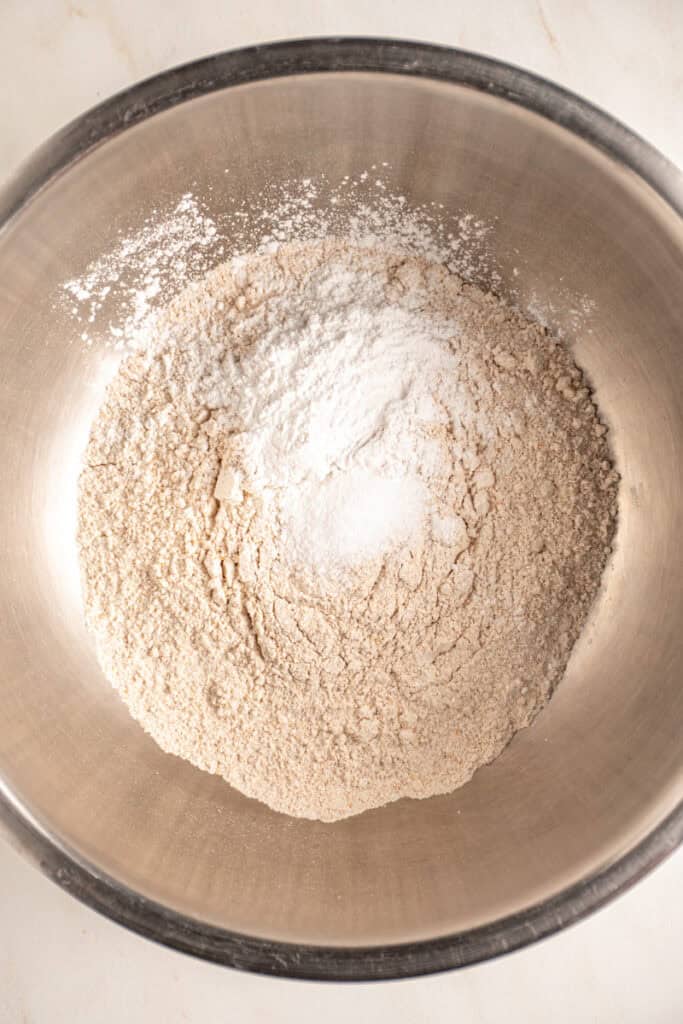 The dry ingredients in a bowl to make whole wheat banana muffins.