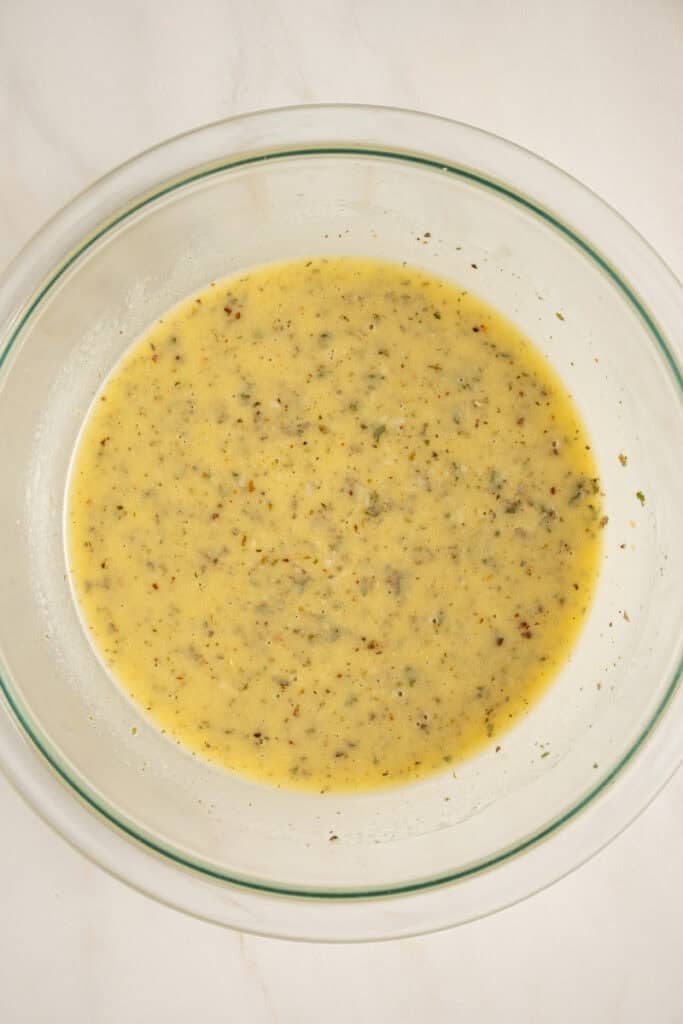 Whisked together ingredients to make homemade italian dressing.